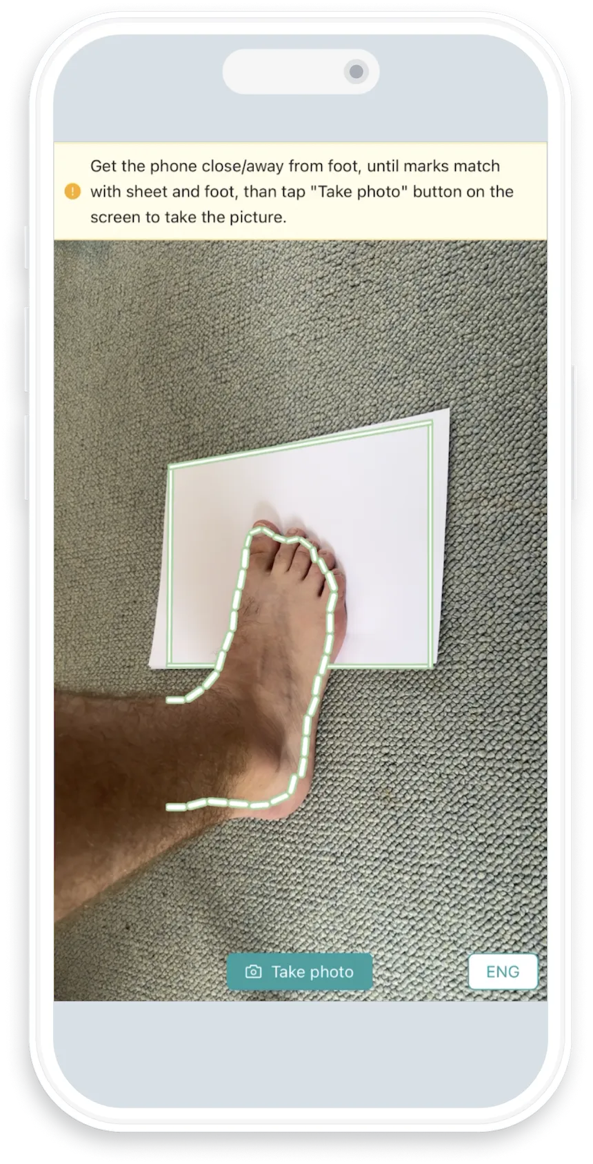 ZOLES mobile app interface showing foot scanning step with instructions to get phone close to foot, displaying user's foot positioned on white paper with 'Take picture' button