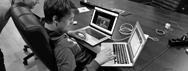 Developer working on a contribution to rubocop-rspec at a two-laptop setup